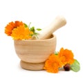 Calendula flowers, mortar and pestle