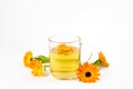 Calendula officinalis the pot marigold tea in cup. Royalty Free Stock Photo