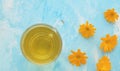 Calendula tisane in glass mug