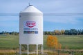 A large white grain silo with the \