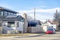 A neighbourhood with houses with solar panels and an electric car. Concept: Renewable