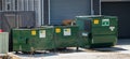 Several Waste Management Canada green garbage dumpster of waste Royalty Free Stock Photo