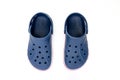 Top view of a couple of blue Crocs Sandals on a white table