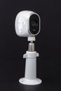 An Arlo security camera on black background