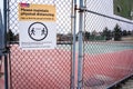 A Covid-19 safe distancing sign at tennis courts in the community of Scenic Acres during a