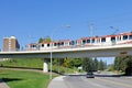 A Calgary Ctrain crossing a bridge during the afternoon in the summer Royalty Free Stock Photo