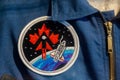 Embroidered Canadian uniform patch showcasing a red maple leaf, a stylized rocket ascending Royalty Free Stock Photo