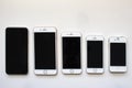 Several iPhone screens from view on a white background