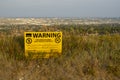 A sign with the text: WARNING THIS AREA HAS BEEN SPOT TREATED FOR PESTS, at nose hills