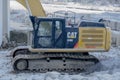 A close up to a Hydraulic Excavator Operator Station during the winter
