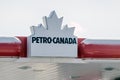 A close-up view of a PETRO-CANADA sign prominently displayed atop the facade of a Royalty Free Stock Photo