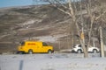 A DHL delivery shipping truck on the road during winter Royalty Free Stock Photo