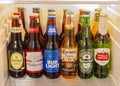 A group of world popular beer brands inside of a fridge