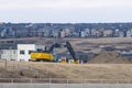 A John Deere 300G Hydraulic Excavator in a new development in the North West of Calgary Royalty Free Stock Photo