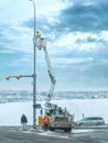 A utility service truck equipped with an aerial work platform and a Hi-Ranger Overcenter Royalty Free Stock Photo