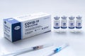 A Pfizer box of vials vaccine bottles with an injection Syringes of covid-19 immunization Royalty Free Stock Photo