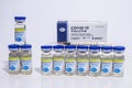 Several Pfizer vials vaccine bottles of covid-19 immunization with package box and an Royalty Free Stock Photo