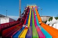 Riders enjoy using the giant slide, known as the Euroslide at the midway at the Calgary