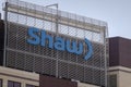 A close up to a Shaw building sign during spring