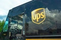 A close up to an UPS logo of a delivery truck