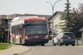 A Calgary Transit bus and a Police service car