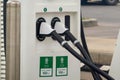 A close up to an electric station vehicle charging plug