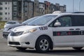 A close up to a Calgary United Cabs taxi van
