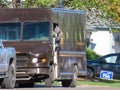 A drivers side of a UPS Truck Van parked during a hot day in spring Royalty Free Stock Photo