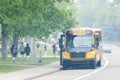 A School bus picking up students during a smoky and hazy day during the wildfires of