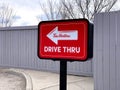 A Tim Hortons Drive Thru signage signal at a coffee shop.