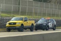 A Traffic Cop Police stoping a yellow truck. Concept: speeding tickets