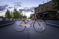 A vintage ladies Huffy cruiser bicycle parked on a pathway in front of a restaurant during a Royalty Free Stock Photo