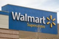 A Walmart supercentre sign at an entrance