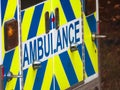 A close up to the back of an Emergency 911 vehicle showing the text Ambulance