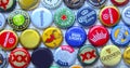 Various domestic craft beer caps of imported beers from around the world rotating Royalty Free Stock Photo