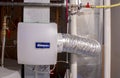 A GeneralAire home humidifier attach to the return duct with a bypass connection to the