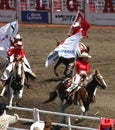 Cowgirls galloping on horseback