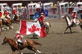 Cowgirls galloping on horseback