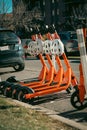 Orange scooters parked on the road Royalty Free Stock Photo