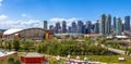 Calgary Downtown skyline during summer and Indigenous tipi\'s on display in the Indian