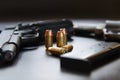 .45 Caliber hollow point bullets near handgun and magazine Royalty Free Stock Photo