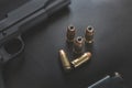 .45 Caliber hollow point bullets near handgun and magazine Royalty Free Stock Photo