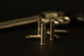 357 Caliber hollow point bullets near revolver pistol gun on black background Royalty Free Stock Photo