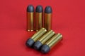 The .45 caliber revolver cartridges on red