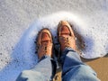 California beach shot of my boots with the sea foam lapping at my feet. For travel blogs as a banner image, graphic, social media