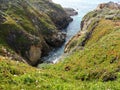 Inlet along the California Coastal Cliffs and a small pebbles beach - Road Trip down Highway 1