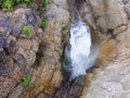 California Coastal Rocks and Cliffs, small bridge above a cascading waterfall with splashing water - Road Trip down Highway 1 Royalty Free Stock Photo