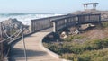 California ocean coast. 17-mile drive wooden boardwalk trail, Pebble beach waves Royalty Free Stock Photo