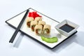 California or Philadelphia sushi rolls set served on a white tray over white background. Japanese cuisine concept Royalty Free Stock Photo