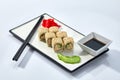 California or Philadelphia sushi rolls set served on a white tray over white background. Japanese cuisine concept Royalty Free Stock Photo